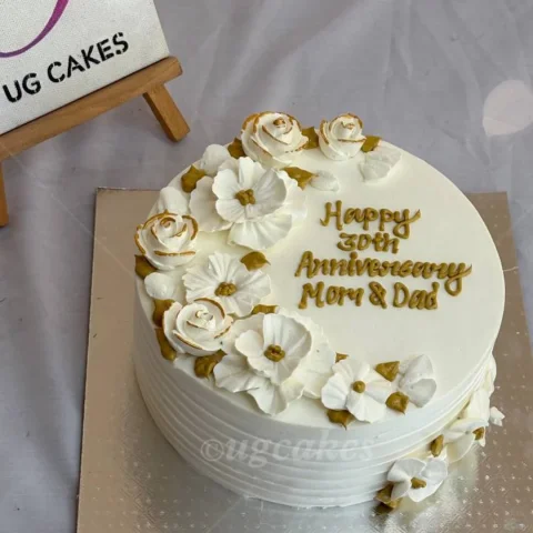 Anniversary Cake with White Flower on Top