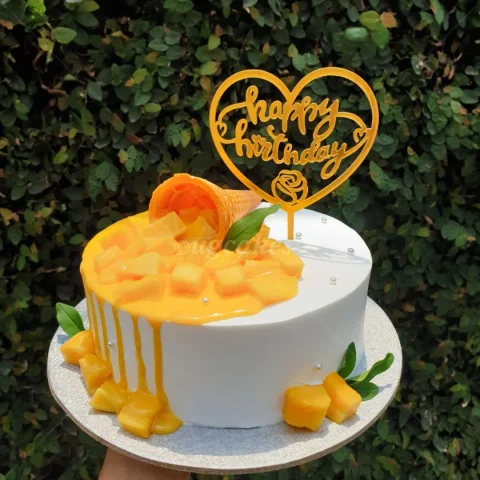 Cake with Mango and Ice-cream cone toppings