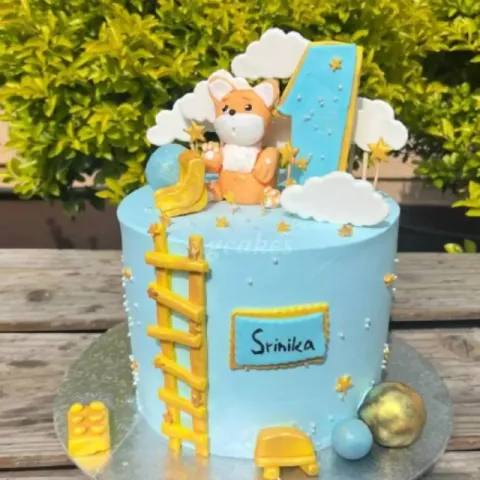 Kids cake with clouds, teddy bear, chocolate balls