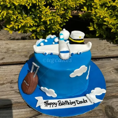Pilot theme cake with suitcase and aeroplane 